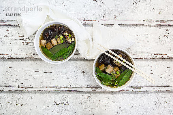 Japanese miso soup,  sugar peas,  shitake,  tofu and mung sprouts