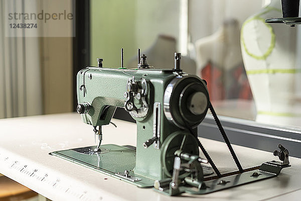 Sewing machine models in fashion designer's studio