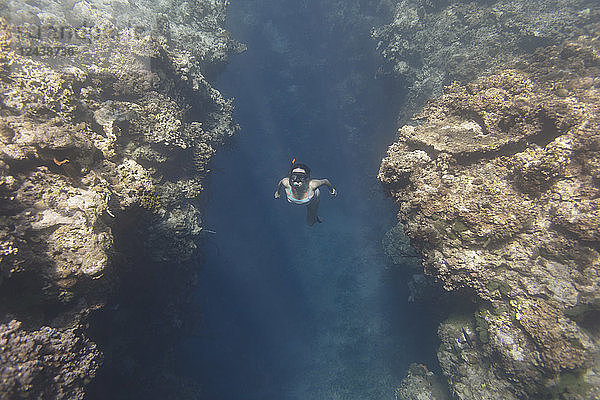 Indonesia,  Bali,  young woman snorkeling