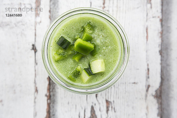 Glass of green Gazpacho,  close-up