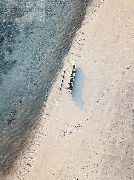 Indonesia,  Lombok,  Aerial view of banca boat at the beach