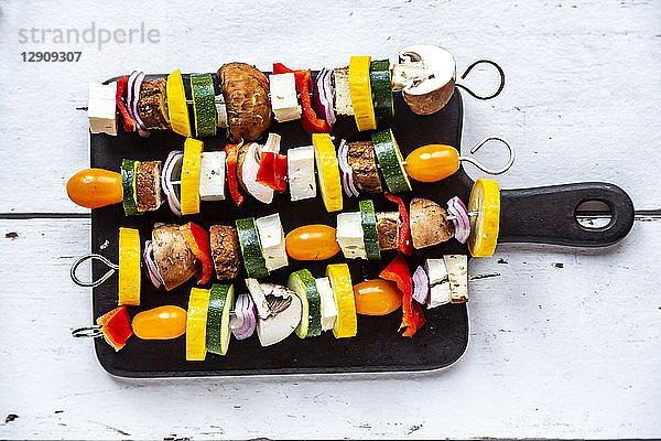Vegetarian grill skewers,  tomato,  yellow and green zucchini,  tofu,  feta,  onion and champignon