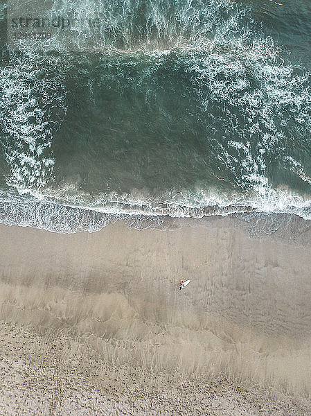 Indonesia,  Bali,  Aerial view of Padma beach,  surfer