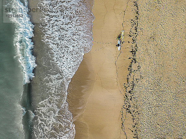 Indonesia,  Bali,  Aerial view of Pandawa beach,  two surfers