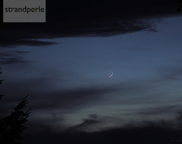 Conjunction of waxing crescent moon and Venus,  early evening,  November 26,  2011; Oregon,  USA.