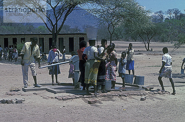 Group of villagers at a water pump Monkey Bay,  Malawi.