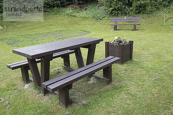 Plaswood picnic table seat and planter made from 100% recycled plastic. Three Bees church community Wildlife Garden,  Mickleton,  Cotswolds,  UK