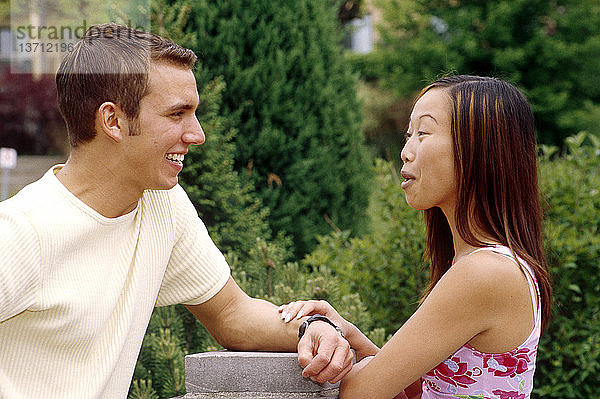 A Canadian boy and a Filipina girl share a laugh.