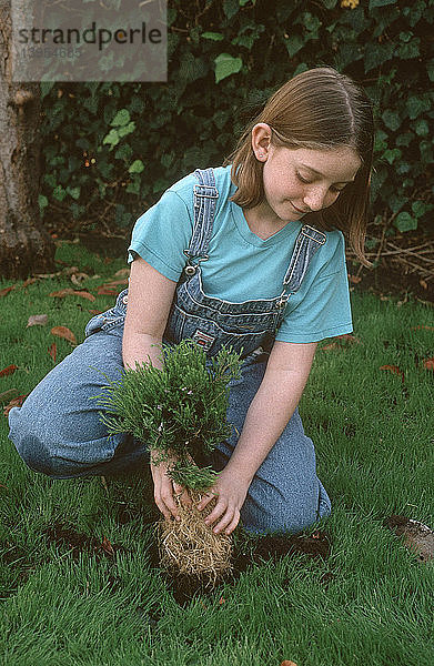 Girl Planting a Tree