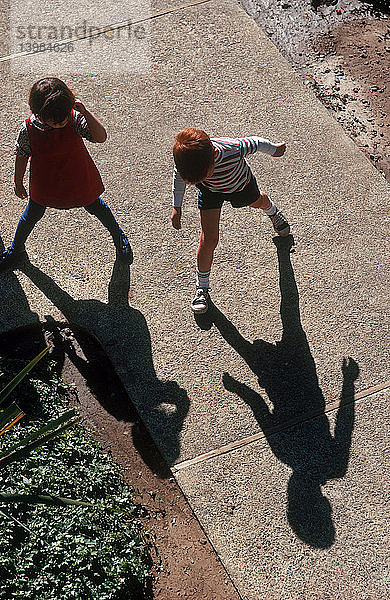 Children playing with Shadows
