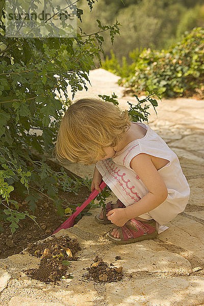 Girl Playing in Garden