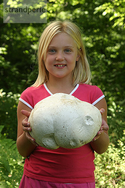 Girl holding a Giant Puffball Mushroom