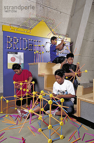 Boys Playing with Construction Shapes