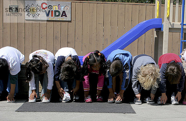 Preschool children exercising in schoolyard